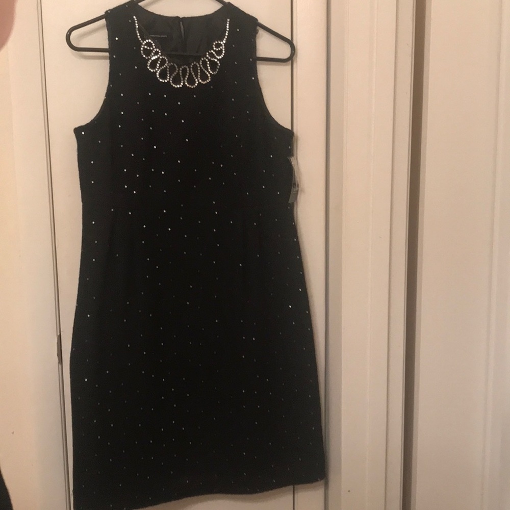 Black w/ small sequin detail & crystal neckline.